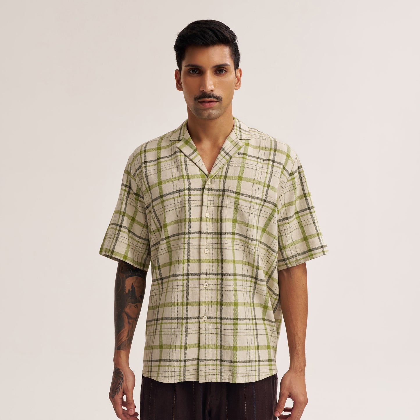 Back view of off white and green check handwoven shirt