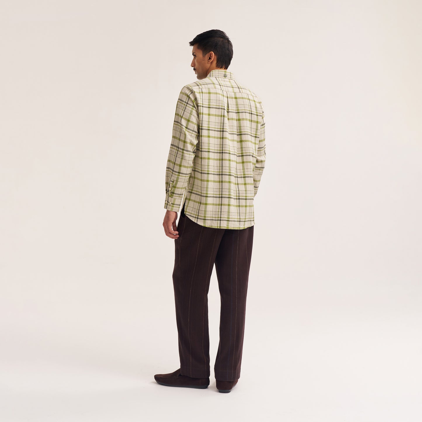 Collar and placket detail of check cotton shirt in green and white