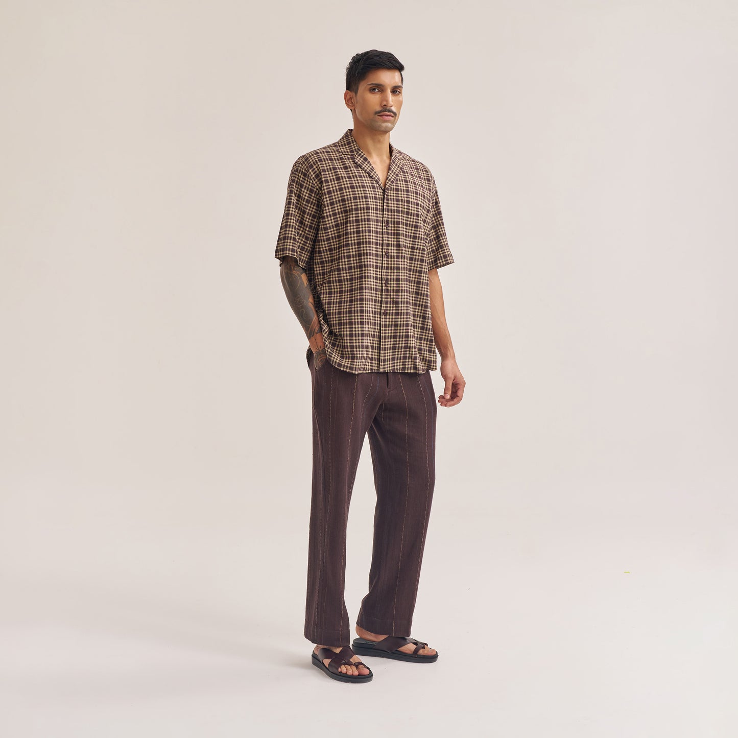 Back view of dark brown check handwoven cotton shirt