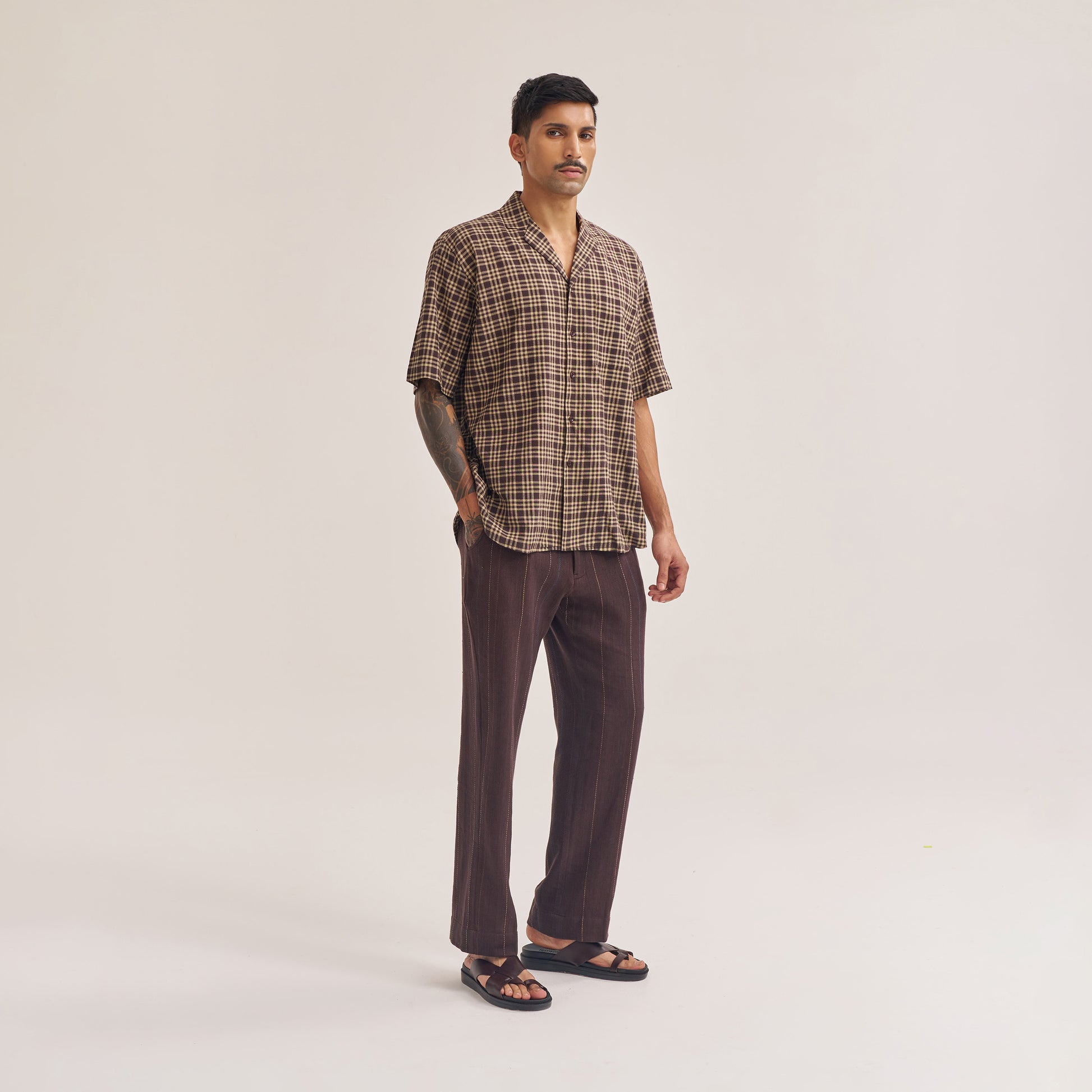 Back view of dark brown check handwoven cotton shirt