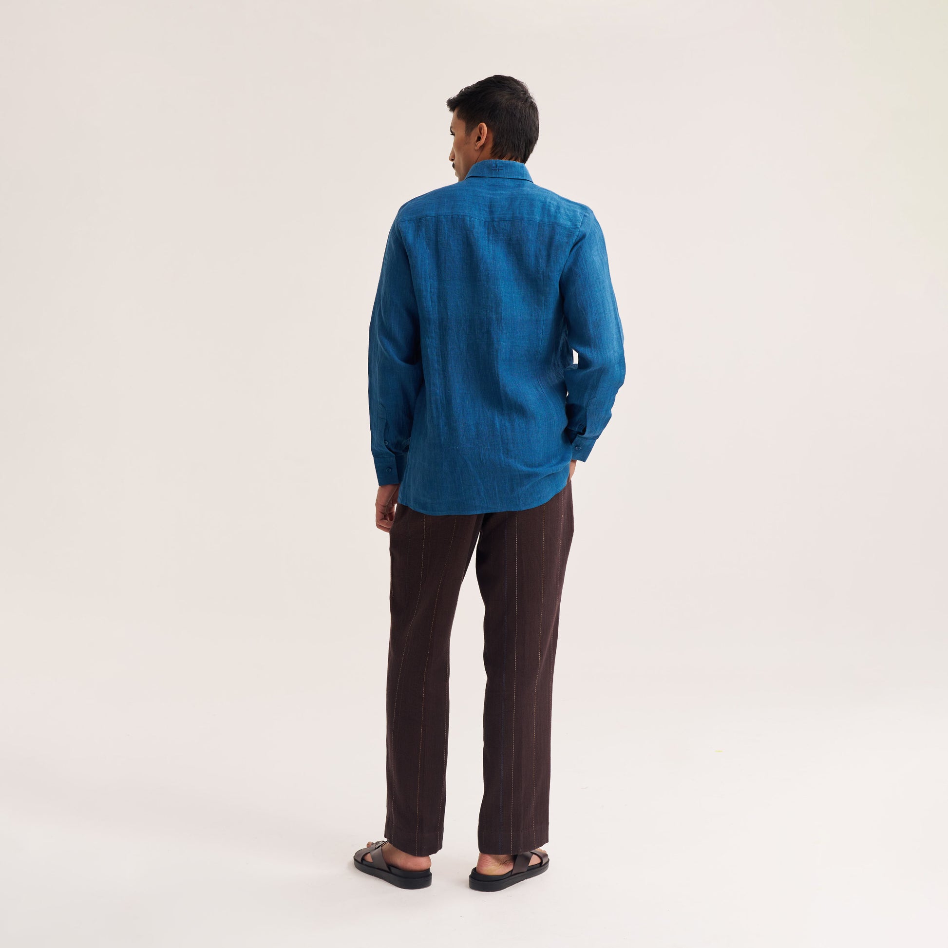 Model wearing slim fit indigo linen shirt outdoors